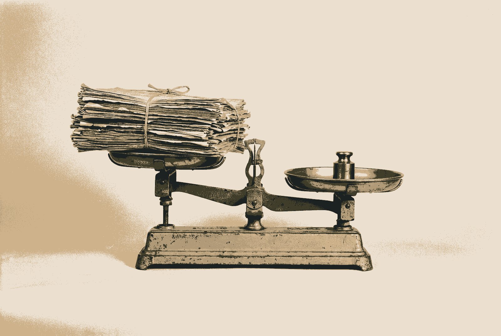 An old two-pan balance with a thick bundle of papers on one pan and a single small brass weight on the other.