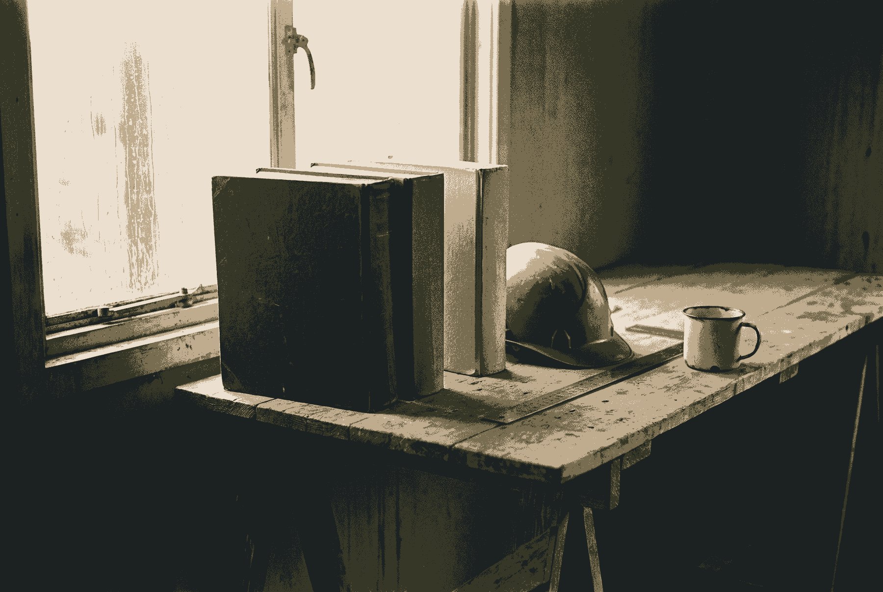 Three thick bound volumes, one dark and two pale, standing on a trestle table by a site-cabin window, beside a hard hat, a steel rule and an enamel mug.